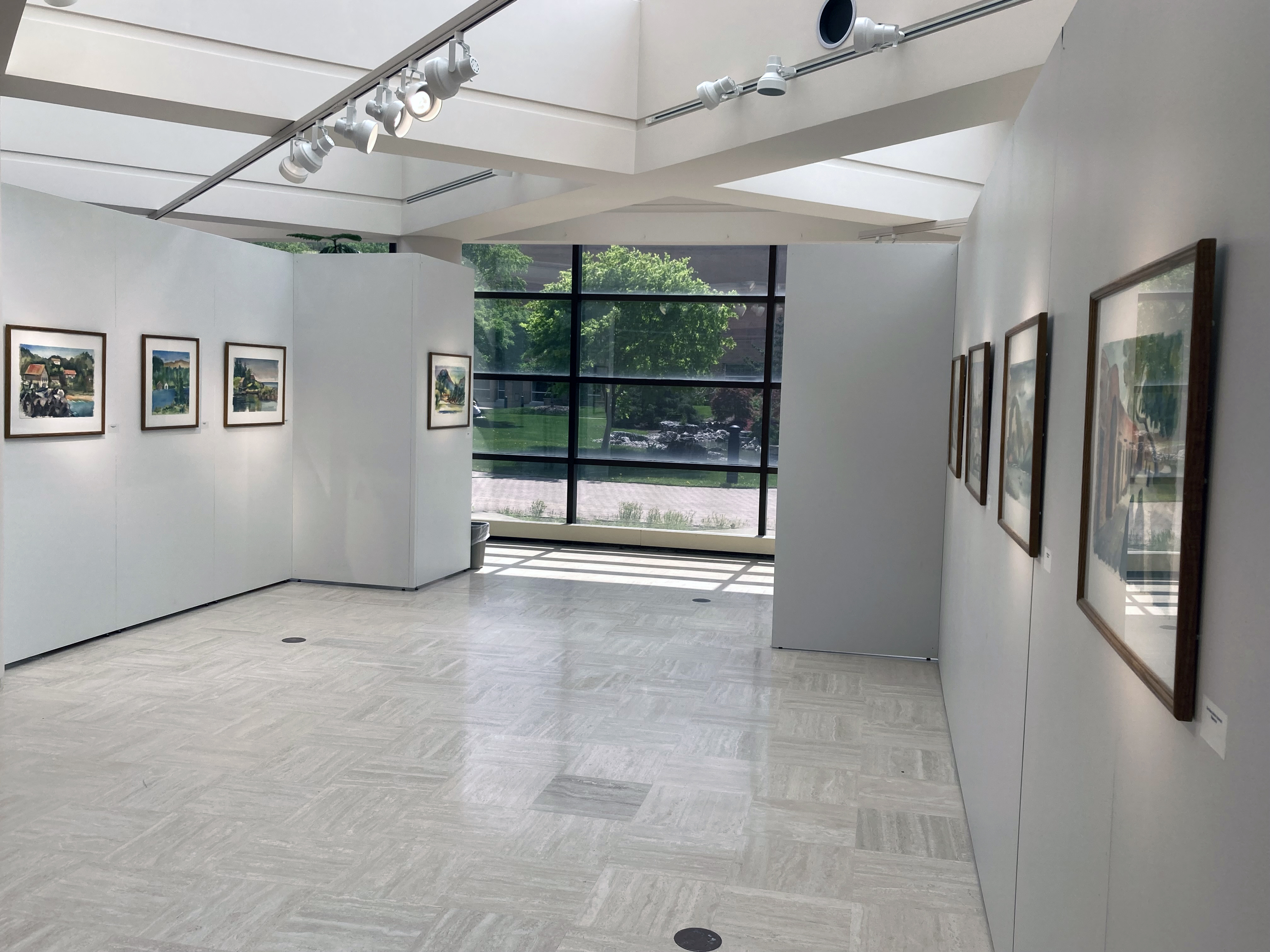 Back section of exhibition with watercolor paintings